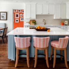 White Cottage Kitchen With Red Barstools