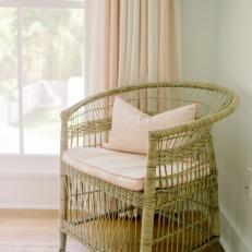 Woven Chair With Pink Pillows