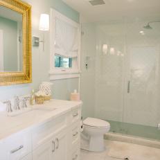 Blue and White Cottage Bathroom With Cane Mirror
