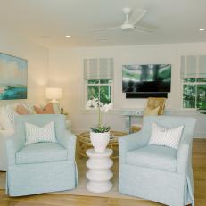 Cottage Living Room With Blue Swivel Chairs