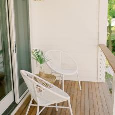 Small Balcony With White Chairs