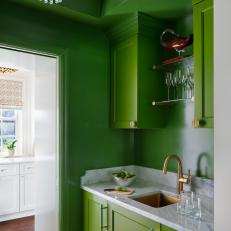 Breathtaking Bright Green Home Bar With Lacquered Paint and Wallpapered Ceiling