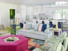Bold and Beautiful Eclectic Style Living Room With a Pink Upholstered Coffee Table