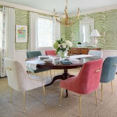Eclectic Dining Room With Colorful Dining Chairs and Grasscloth Wallpaper