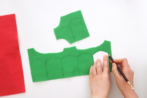 Trace the template onto green felt and cut it out six times.