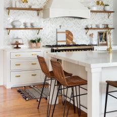 Luxe White Kitchen with Herringbone Tile Backsplash