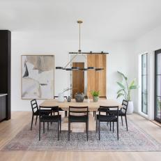 Neutral Contemporary Dining Room With Black Buffet