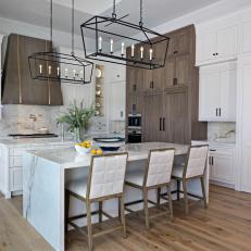 Transitional White Chef Kitchen With Brown Range Hood