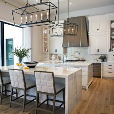 Brown and White Transitional Chef Kitchen With Two Islands