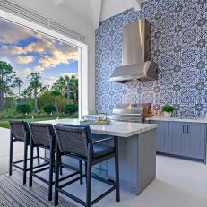 Blue Coastal Outdoor Kitchen With Tile Wall