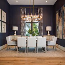 Blue Coastal Dining Room With High Ceiling