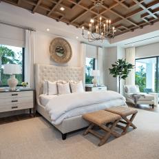 Neutral Coastal Bedroom With Wood Ceiling