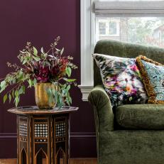 Unique Side Table and Vintage Sofa in Purple Living Room