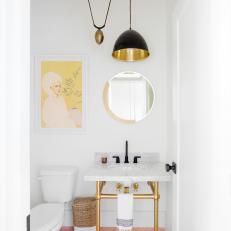 Contemporary Powder Room With Dramatic Pendant Light, Gold Accents and Pink Tiled Floor 