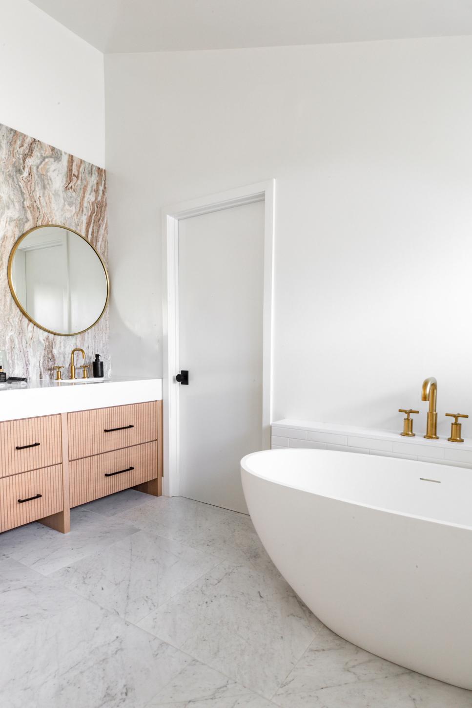 Bathroom With Freestanding Tub and Marble Backsplash HGTV