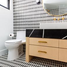 Single Vanity Bathroom With Black and White Tile