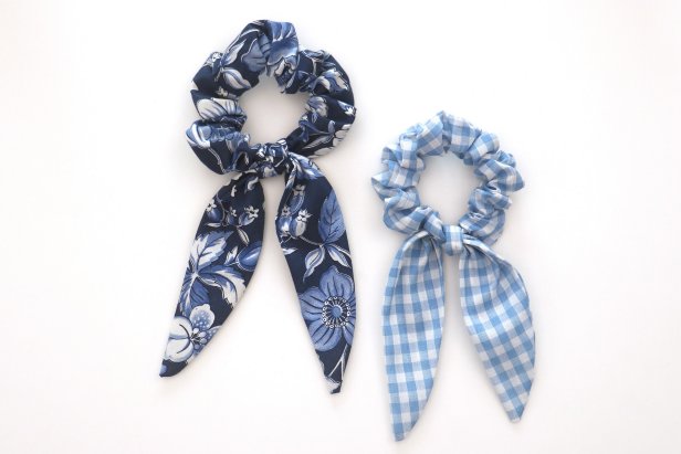 Tie the scarf onto the scrunchie. You can adjust it until you’re happy with how it looks, and since it’s not sewn on, you can wear the scrunchie with or without the scarf.