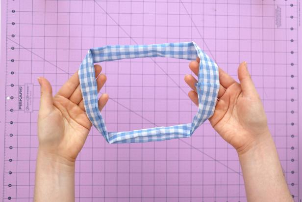 Sew the short seam together. Then reach through the remaining opening and finish turning the tube inside out. You should end up with a large circle.