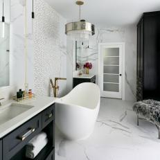 White Spa Bathroom With Gray Furry Stool