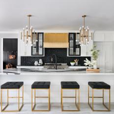 Black and White Open Plan Kitchen With Striped Countertop