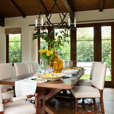 Stunning Dining Room With Large French Doors and High Vaulted Ceilings