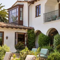 Mediterranean Style Home With Countless Archways and Spanish Style Roof