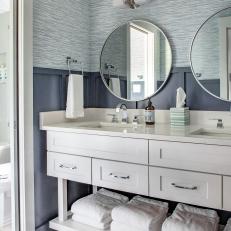 Blue and White Coastal Bathroom With Wainscoting