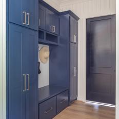 Blue and White Coastal Mudroom With Straw Hat