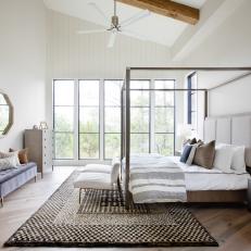 White Contemporary Bedroom With Four Poster Bed and Graphic Area Rug 