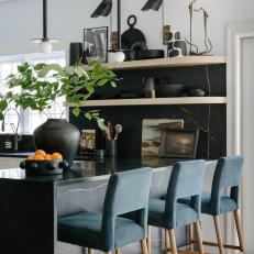 Black Contemporary Kitchen With Blue Barstools