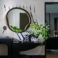 Modern Black and White Foyer With Green Leaves