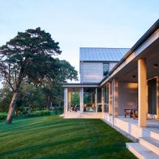 Contemporary Wraparound Covered Porch With Sitting Areas 