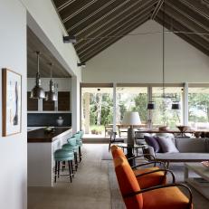 Contemporary Living Room and Dining Peninsula With Exposed Vaulted  Beam Ceiling 