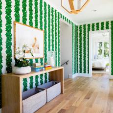 Transitional Foyer With Dramatic Green and White Wallpaper
