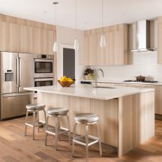 Tan Modern Kitchen With Silver Stools