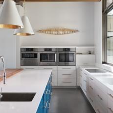 White Modern Kitchen With Blue Island