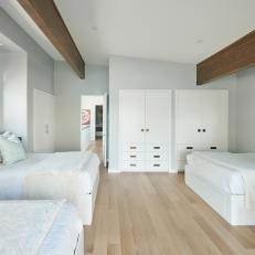 Neutral Guest Bedroom With Four Beds