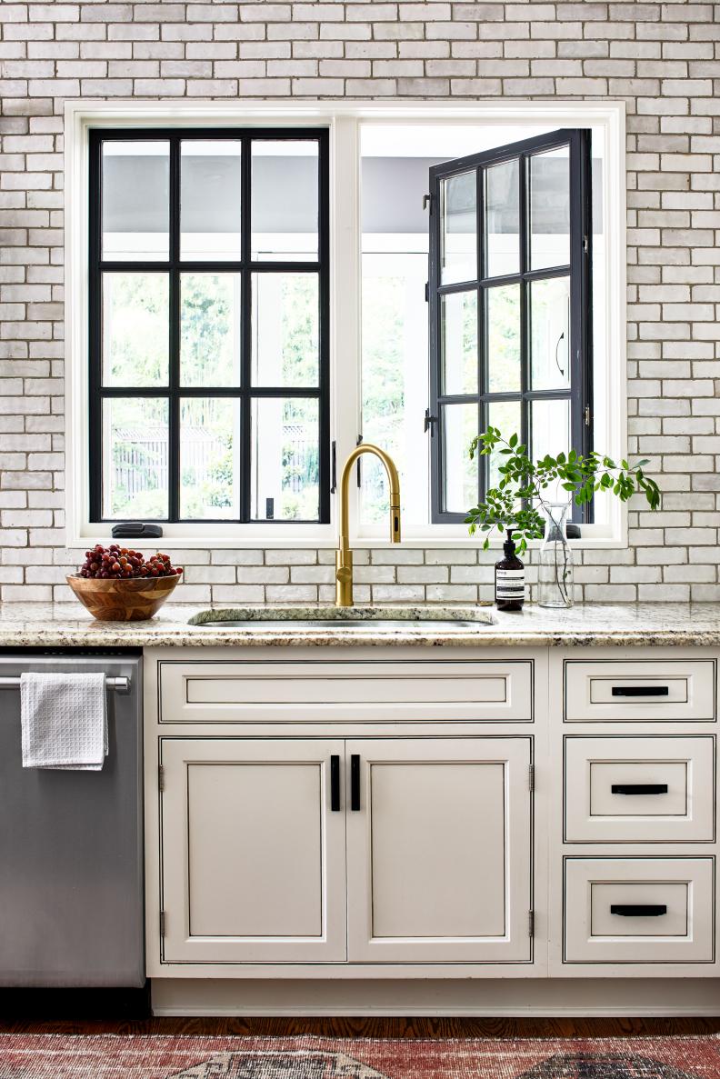 White Brick Accent Wall Around Black Steel Framed Kitchen Windows