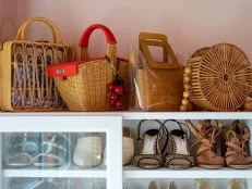 Glass Cabinet With Shoes and Handbags on Top
