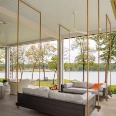 Contemporary Sofa Swings and Sitting Area With River View on Covered Porch 