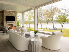 White Contemporary Riverside Covered Patio With Sitting Area and Stone Fireplace 