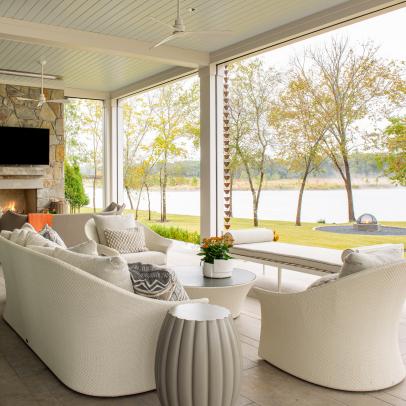 White Contemporary Riverside Covered Patio With Sitting Area and Stone Fireplace 