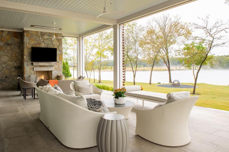 White and neutral covered patio with river view.