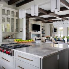 White Transitional Open Plan Kitchen and Living Room With Dark Exposed Beam Ceiling 