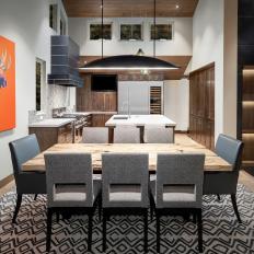 Contemporary Dining Room With Orange Art