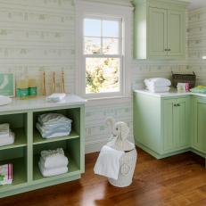 Green and White Laundry Room With Themed Wallpaper 