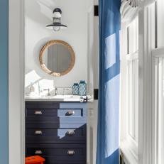 Blue and White Coastal Bathroom With Nautical Details 