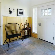 Country Foyer With Yellow Wainscoting