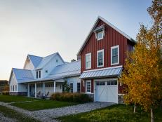Red Trimmed Barn Garage Attached to Classic White Country Exterior