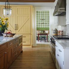 Country Kitchen With Yellow Panel Fridge